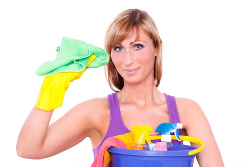 Technician preparing carpet cleaning equipment with safety focus