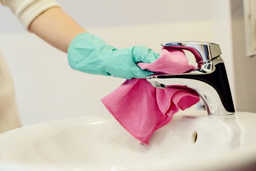 Deep cleaning service in Queenspark removing dust from a bright living room