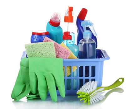 Professional carpet cleaner managing hoses and wet floor hazards